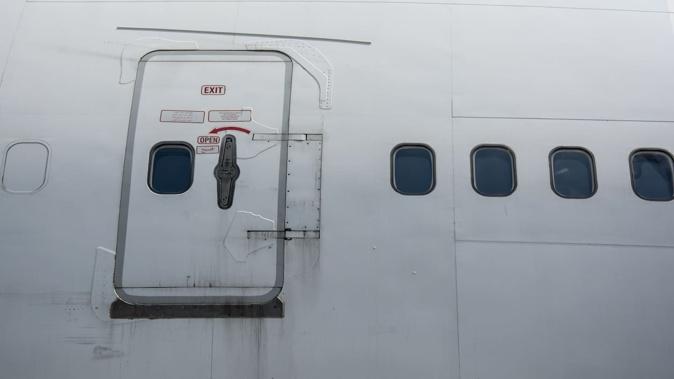 Korean Air Restrain Passenger Trying to Open Exit Door