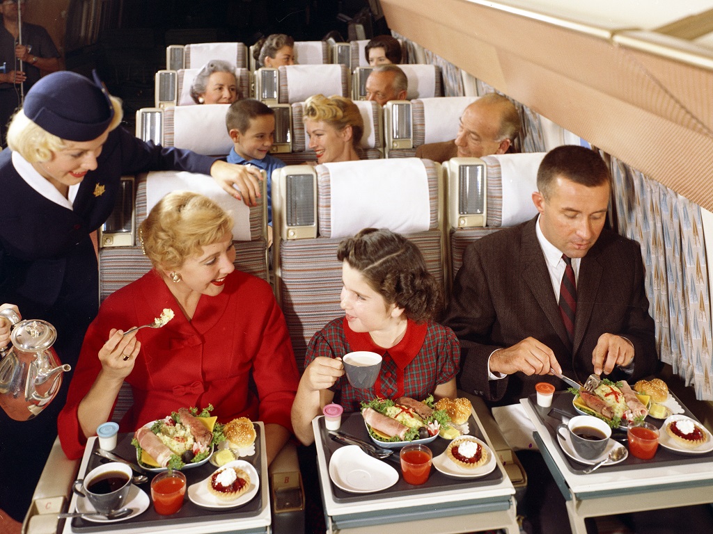 Passengers enjoy an economy meal